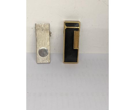 A Dunhill lighter together with silver cigar cutter, hallmarked Birmingham 1991Location: 