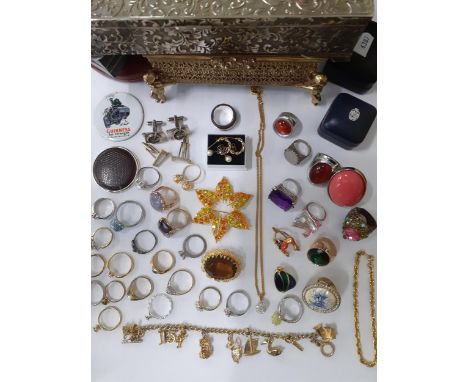 A quantity of costume jewellery to include costume rings, gold tone items, cufflinks, vintage brooches, mixed jewellery boxes