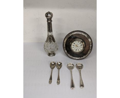 A silver Kitney and Co London bedside table clock, hallmarked London 1997, together with a 19th century scent, and four silve