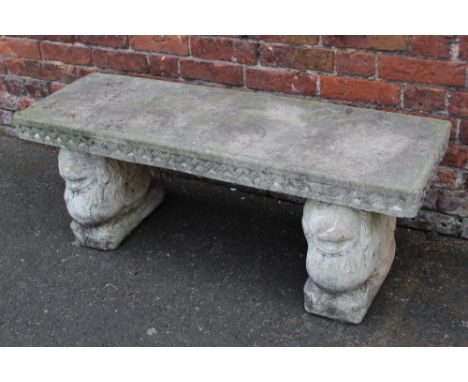 A STONE GARDEN BENCH WITH LION SUPPORTS W-120 CM H-46 CM