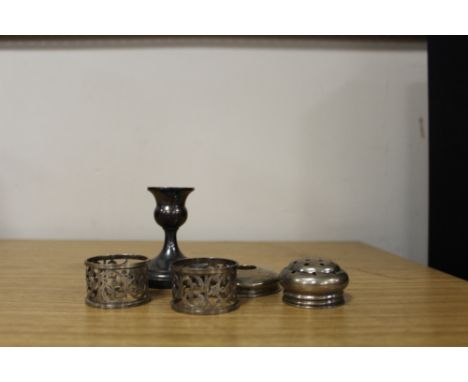 A HALLMARKED SILVER FILLED CANDLE STICK, TOGETHER WITH A PAIR OF HALLMARKED SILVER NAPKIN RINGS AND TWO SILVER VANITY JAR LID