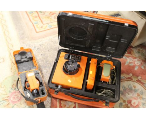 A VINTAGE WILD HEERBRUGG DISTOMAT DISTANCE METER TOGETHER WITH A WILD HEERBRUGG SURVEYORS LEVEL