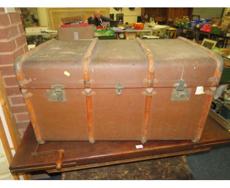 A LARGE VINTAGE BANDED PACKING TRUNK