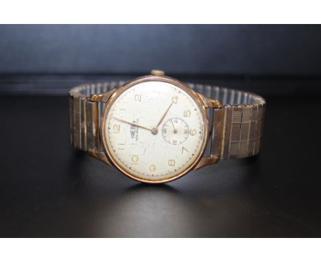 A VINTAGE TREBEX WRIST WATCH - PROBABLY GOLD, ON STAINLESS STEEL EXPANDABLE BRACELET