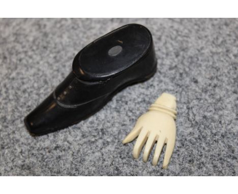 AN ANTIQUES SHOE SHAPED SNUFF BOX - LID BROKEN, TOGETHER WITH A CARVED IVORY BACK SCRATCHER HAND