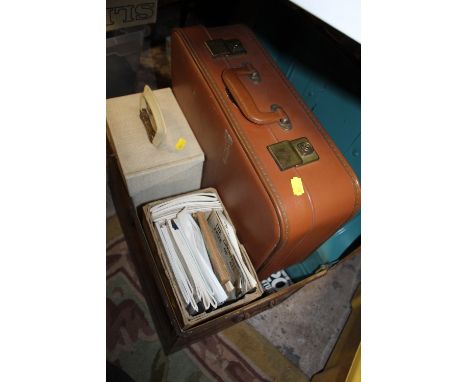 A TIN TRUNK CONTAINING HISTORY OF THE 20TH CENTURY MAGAZINES, VINTAGE SHEET MUSIC ETC., TOGETHER WITH A CASE OF 7" SINGLE REC