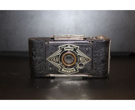 AN ENSIGN MIDGET POCKET CAMERA 