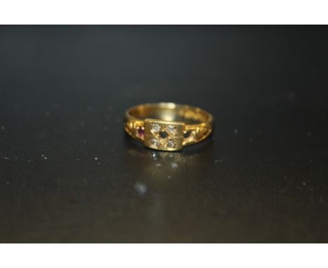 A HALLMARKED 18 CARAT GOLD RUBY AND DIAMOND RING MISSING TWO STONES - APPROX WEIGHT 2.1G 