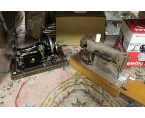 A CASED VINTAGE SINGER SEWING MACHINE TOGETHER WITH ANOTHER 