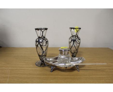 A SILVER PLATED INKWELL ON STAND MOTHER OF PEARL STEMMED PEN TOGETHER WITH A PAIR OF GLASS VASES WITH SILVER OVERLAY