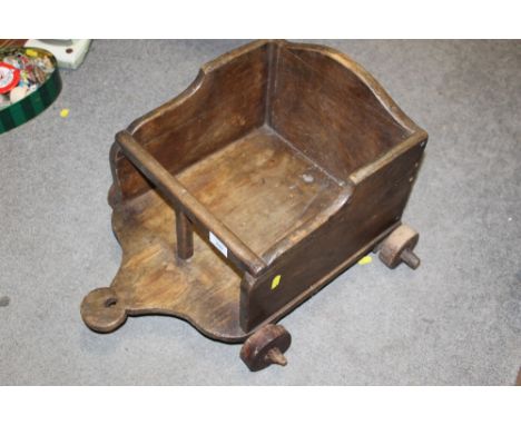 A VINTAGE WOODEN CHILDS PULL ALONG CART 