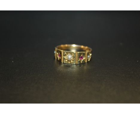 A HALLMARKED 15CT GOLD SEED PEARL AND RUBY RING - APPROX WEIGHT 2.9G 