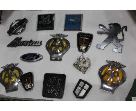 A BOX OF VINTAGE CAR BADGES 