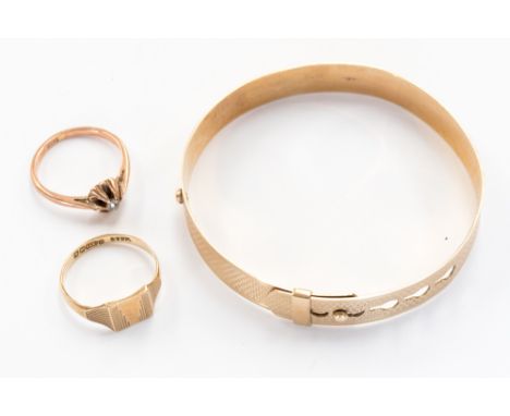 A 9 ct gold Christening bangle together with two 9 ct gold rings, one set with old cut diamond, weighing approx. 0.10 ct, tot