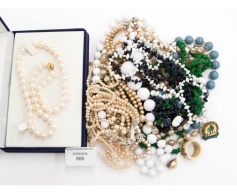 A boxed single string of faux pearls, with a group of faux pearl necklaces (some a/f) and other assorted necklaces