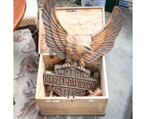 A carved wood advertising sign: Harley Davidson Motor Cycles, six carvings of horses and a clockwork monkey (1 chest) 
