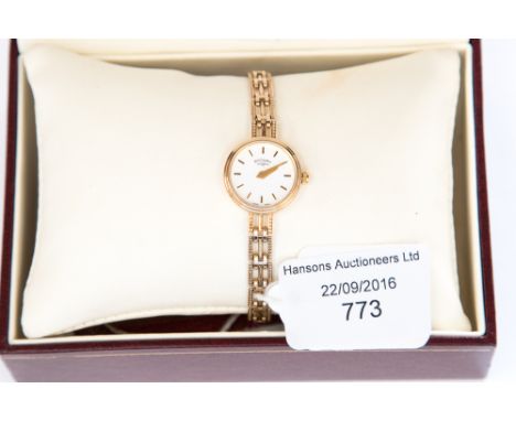 A 9 ct gold ladies' Rotary wristwatch on a 9 ct gold gate link bracelet, purchased in 1998 
