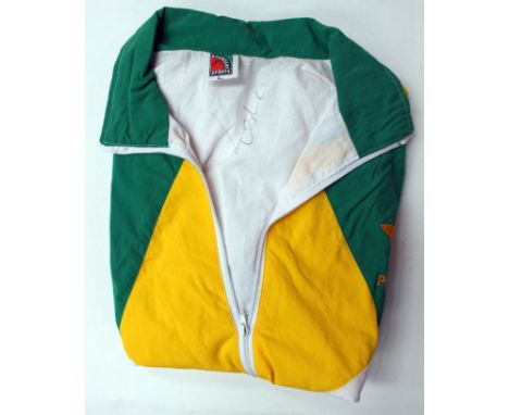 Cricket memorabilia: a green, white and yellow Pakistan match worn jacket signed by Wasim Akram to inside