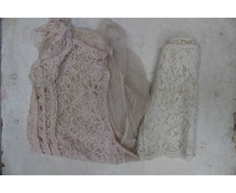 A pale peach lace modesty blouse with a lace bodice, tulle back and a Peter Pan collar, 1930s, together with a roll of cream 