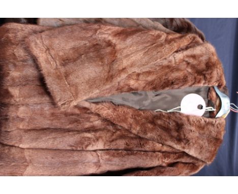 A dark brown Canadian squirrel fur 3/4 length coat together with a medium brown Canadian squirrel fur jacket, also a brown mu