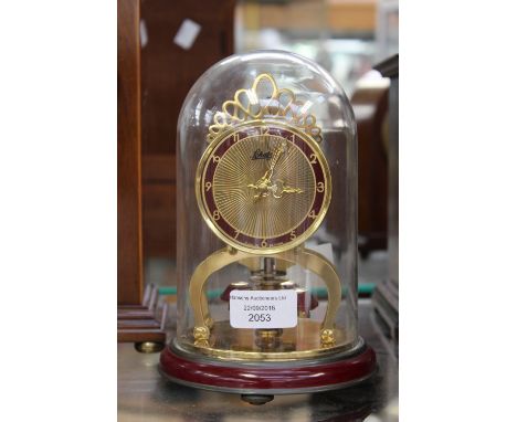 A German skeleton mantel clock under perspex dome, Aug. Schatz and Sohne 