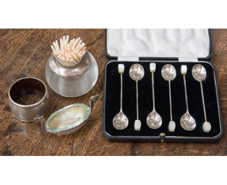 A cased set of silver coffee spoons, set with mother-of-pearl finials, with a silver napkin ring, a glass match striker, set 