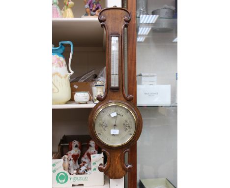 An oak wheel barometer, including thermometer, by J.F. Hull & Scarboro