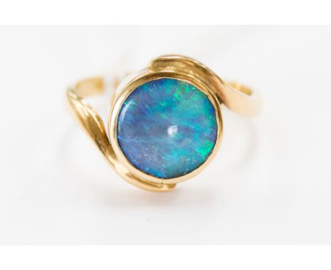 An 18 ct. gold opal doublet dress ring, the black opal doublet in rub-over setting, gross weight approx. 5.5 grms, ring size 