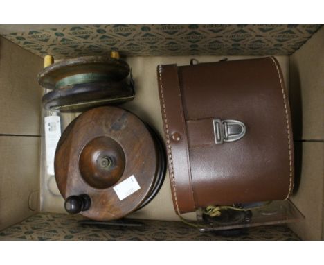Two wooden fishing reels, one with brass fittings, the other with brass and horn, 12.5 cm and 10 cm, together with fishing sc