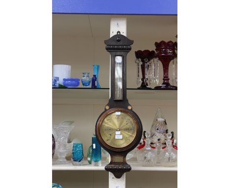 An early 20th Century oak banjo barometer and thermometer, the plaque inscribed 'Presented to HA Williams (late BJM 62nd FLD 