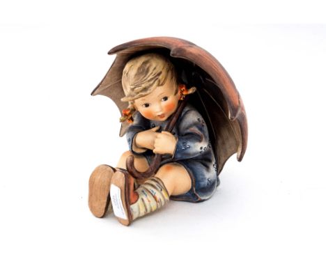 A large Hummel figure of a girl under an umbrella