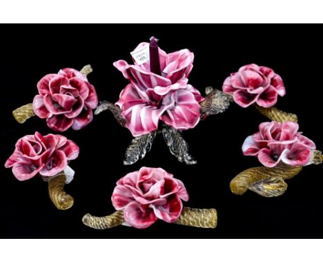 A garniture of five Murano glass flowers and central floral candlestick, opaque rose and white flowers on aventurine rope twi