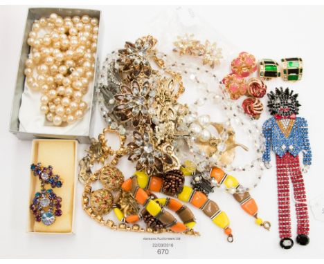 A Butler and Wilson golly brooch, set numerous coloured paste and with articulated limbs in original box together with pair  
