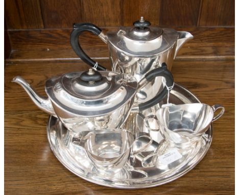 Elkington & Co, a silver plated four piece tea service, of plain Neo-classical boat form, the teapot with ebony handle and fi