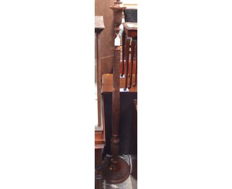 A mid 20th Century hardwood carved standard lamp