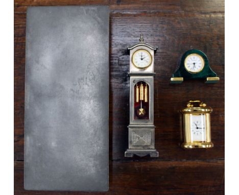 A pewter cigarette box, cedar lined, imprinted to base ' Danmark 2494' with a doll's house white metal longcase clock, and tw