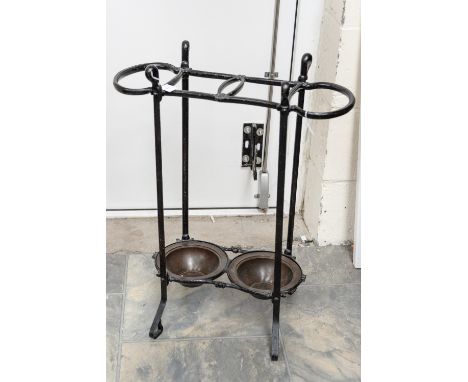 A Victorian cast iron stick stand with copper drip pans