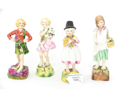 F G Doughty for Royal Worcester, 'The Children of the Nations' figures comprising England 3075, Wales 3103, Scotland 3104 and