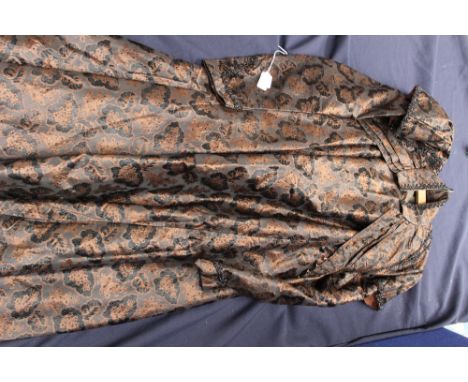 A silk brocade brown  and black Victorian jacket and skirt, having pleats to the front of the bodice and black beading, caps 