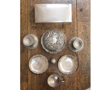 A sterling Smith & Smith cigarette box, two sterling silver pin dishes, pair of sterling weighted dwarf candlesticks, a small