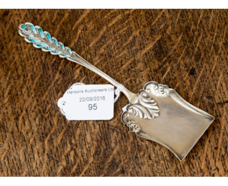 An American sterling silver caddy spoon, stamped, circa 1900, of Art Nouveau design with blue enamel inlay, maker W.N. & Co.,