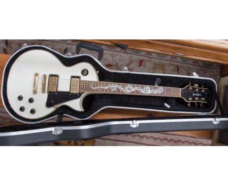 A Joy Turser electric guitar with mother-of-pearl serpent inlay on fret with original hard case with amplifier 'Mango'