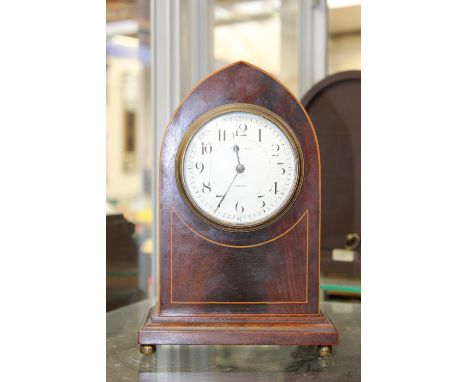 An Edwardian mantel clock, London retailer, French manufacture, with key, stamped Burren, inlaid stringing with enamel dial a