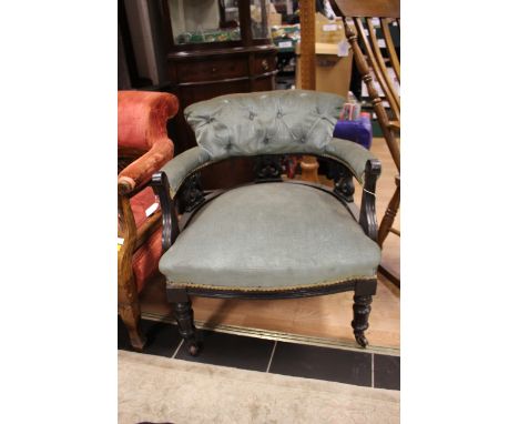 An Edwardian mahogany tub chair, upholstered back, arms and seat, turned legs