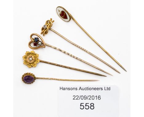 Five gold stick pins comprising pin set with amethyst, seed pearl, diamond chip etc