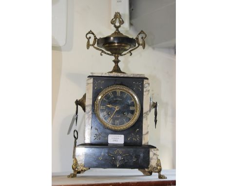 A 19th Century French marble mantel clock, circa 1876, Charrier Niort, gilt metal feet, handles and urn finial, with key and 