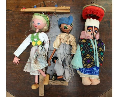 A girl Pellham puppet, with a boy puppet, together with an Ethiopian, soft gentleman doll (3) 