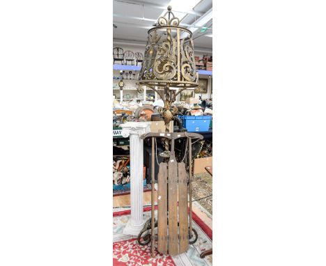 A vintage wooden and metal sledge, a gilt wrought iron standard lamp and shade and a plaster column pedestal (3)