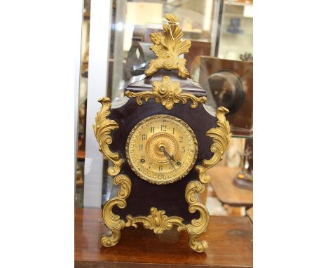 An Ansonia USA mantel clock, circular gilt dial, Arabic numerals and twin winding holes