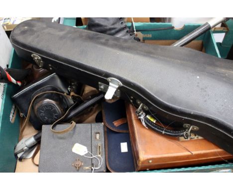 A box of collectables including four cameras, a cased Skylark brand Violin, vintage ice skates, Concorde memorabilia, shootin